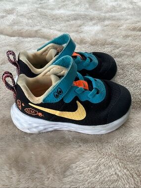 Nike toddler Black Sneakers with Teal and Yellow Accents